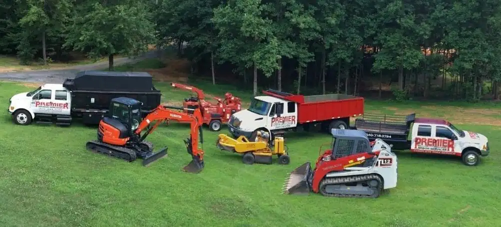 The Premier Arbor Services fleet lined up on a lawn